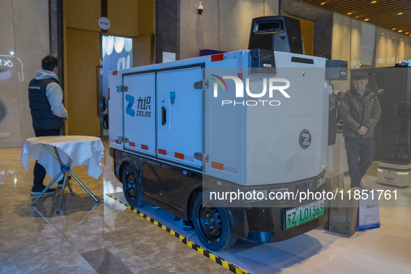 A driverless delivery truck is seen at the 2024 Global Artificial Intelligence Product Application Expo in Suzhou, China, on December 10, 20...