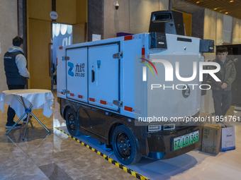 A driverless delivery truck is seen at the 2024 Global Artificial Intelligence Product Application Expo in Suzhou, China, on December 10, 20...