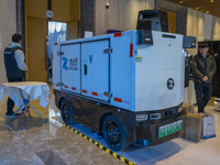 A driverless delivery truck is seen at the 2024 Global Artificial Intelligence Product Application Expo in Suzhou, China, on December 10, 20...