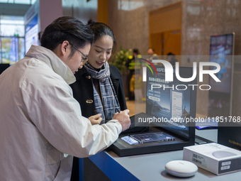 A visitor tries out a handwritten translation system at the 2024 Global Artificial Intelligence Product Application Expo in Suzhou, China, o...