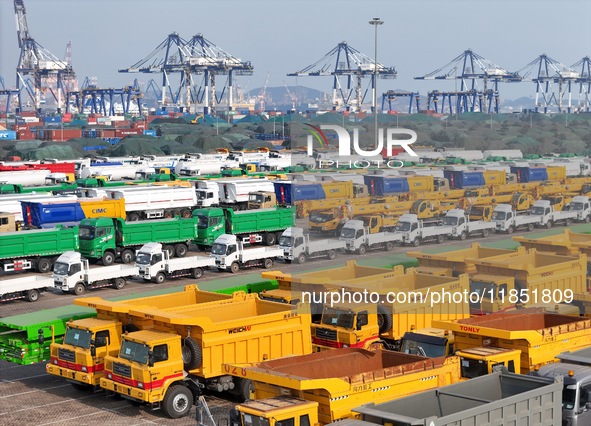 A large number of trucks and construction machinery gather at Yantai Port to be loaded for export in Yantai, Shandong province, China, on De...