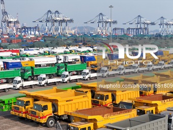 A large number of trucks and construction machinery gather at Yantai Port to be loaded for export in Yantai, Shandong province, China, on De...