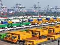 A large number of trucks and construction machinery gather at Yantai Port to be loaded for export in Yantai, Shandong province, China, on De...