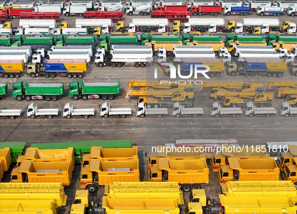 A large number of trucks and construction machinery gather at Yantai Port to be loaded for export in Yantai, Shandong province, China, on De...