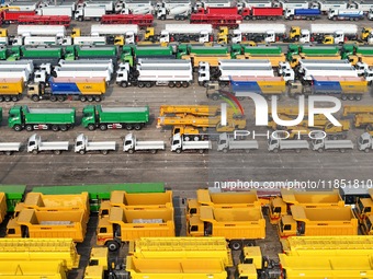 A large number of trucks and construction machinery gather at Yantai Port to be loaded for export in Yantai, Shandong province, China, on De...