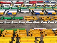 A large number of trucks and construction machinery gather at Yantai Port to be loaded for export in Yantai, Shandong province, China, on De...