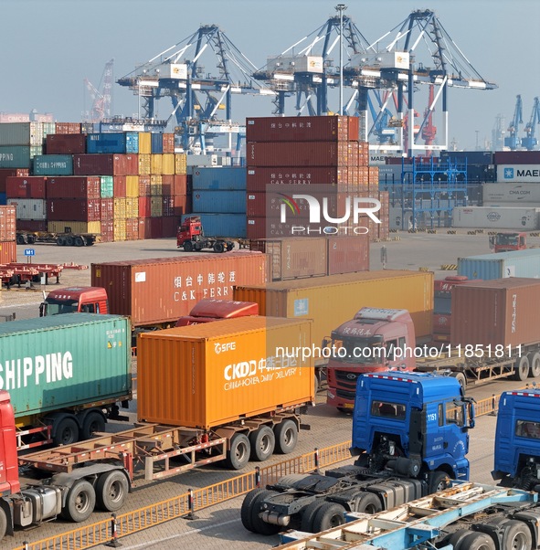 The photo shows the working scene of the International container terminal of Yantai Port, a port in Shandong province, China, on December 10...