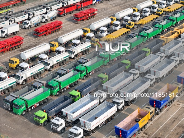 A large number of trucks and construction machinery gather at Yantai Port to be loaded for export in Yantai, Shandong province, China, on De...