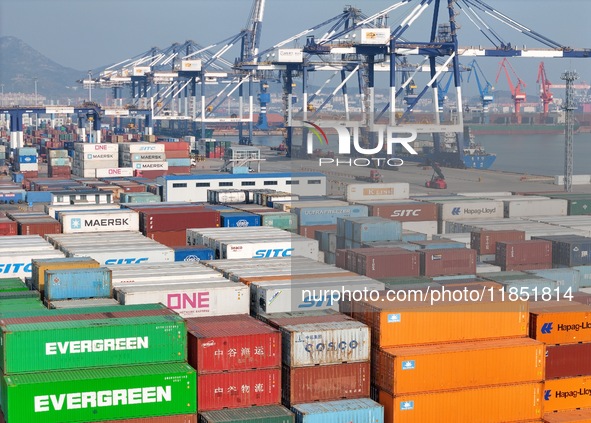 The photo shows the working scene of the International container terminal of Yantai Port, a port in Shandong province, China, on December 10...