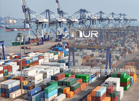 The photo shows the working scene of the International container terminal of Yantai Port, a port in Shandong province, China, on December 10...