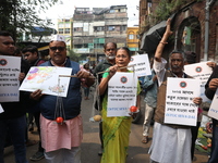 Supporters of the Indian National Congress take part in a protest against the price hike of vegetables in Kolkata, India, on December 10, 20...