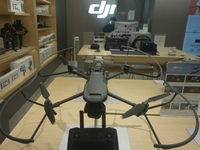 Customers shop for a new aerial drone at a DJI store in Hangzhou, China, on December 10, 2024. (