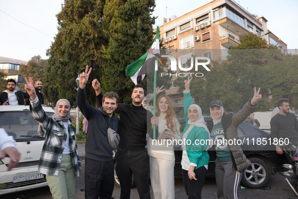 Syrians gather in the Abu Rummaneh neighborhood in central Damascus to celebrate the fall of the Assad regime on December 9, 2024. 