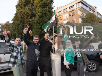 Syrians gather in the Abu Rummaneh neighborhood in central Damascus to celebrate the fall of the Assad regime on December 9, 2024. (