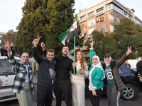 Syrians gather in the Abu Rummaneh neighborhood in central Damascus to celebrate the fall of the Assad regime on December 9, 2024. (