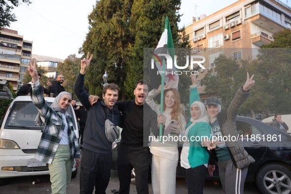 Syrians gather in the Abu Rummaneh neighborhood in central Damascus to celebrate the fall of the Assad regime on December 9, 2024. 