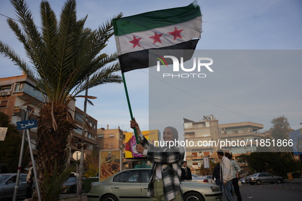 Syrians gather in the Abu Rummaneh neighborhood in central Damascus to celebrate the fall of the Assad regime on December 9, 2024. 