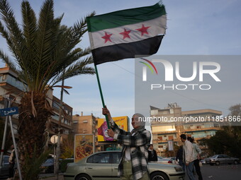 Syrians gather in the Abu Rummaneh neighborhood in central Damascus to celebrate the fall of the Assad regime on December 9, 2024. (