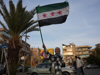 Syrians gather in the Abu Rummaneh neighborhood in central Damascus to celebrate the fall of the Assad regime on December 9, 2024. (