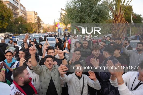 Syrians gather in the Abu Rummaneh neighborhood in central Damascus to celebrate the fall of the Assad regime on December 9, 2024. 