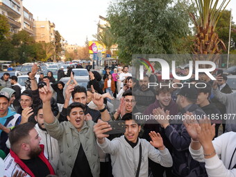 Syrians gather in the Abu Rummaneh neighborhood in central Damascus to celebrate the fall of the Assad regime on December 9, 2024. (