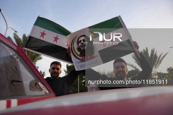 Syrians gather in the Abu Rummaneh neighborhood in central Damascus to celebrate the fall of the Assad regime on December 9, 2024. 