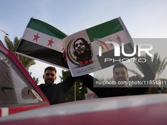 Syrians gather in the Abu Rummaneh neighborhood in central Damascus to celebrate the fall of the Assad regime on December 9, 2024. (