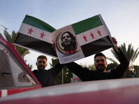 Syrians gather in the Abu Rummaneh neighborhood in central Damascus to celebrate the fall of the Assad regime on December 9, 2024. (