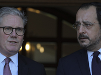 Britain's Prime Minister Keir Starmer talks with Cyprus' President Nikos Christodoulides as he leaves the Presidential Palace in Nicosia. Cy...