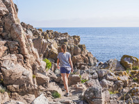 The rocky Baltic Sea coast is seen in Gudhjem, Bornholm Island, Denmark, on August 5, 2024. (