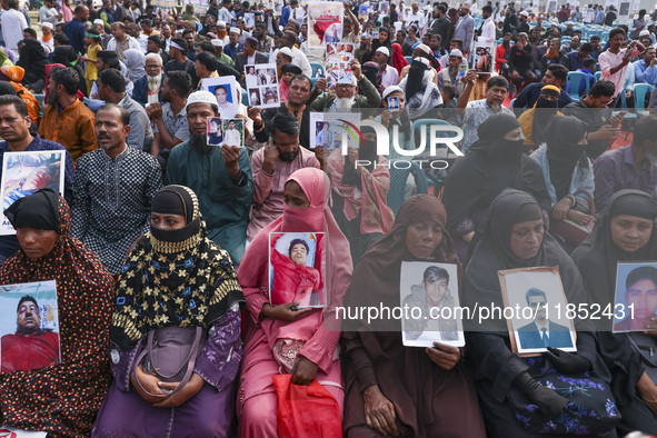 Protesters gather for a rally by Mayer Daak, a platform for the victims of enforced disappearances, on International Human Rights Day in Dha...