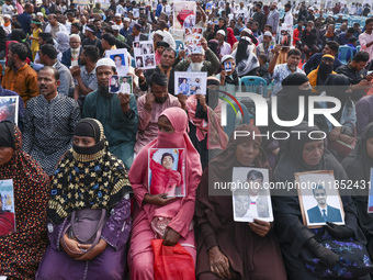 Protesters gather for a rally by Mayer Daak, a platform for the victims of enforced disappearances, on International Human Rights Day in Dha...