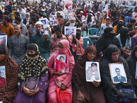 Protesters gather for a rally by Mayer Daak, a platform for the victims of enforced disappearances, on International Human Rights Day in Dha...