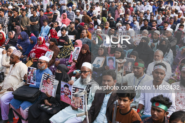 Protesters gather for a rally by Mayer Daak, a platform for the victims of enforced disappearances, on International Human Rights Day in Dha...