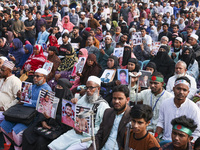 Protesters gather for a rally by Mayer Daak, a platform for the victims of enforced disappearances, on International Human Rights Day in Dha...