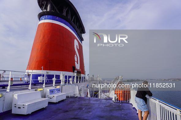 People on board the Stena Line Ferry look at the Sweden Baltic Sea coast in Karlskrona, Sweden, on August 16, 2024. 