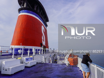 People on board the Stena Line Ferry look at the Sweden Baltic Sea coast in Karlskrona, Sweden, on August 16, 2024. (