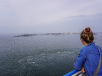 People on board the Stena Line Ferry look at the Sweden Baltic Sea coast in Karlskrona, Sweden, on August 16, 2024. (