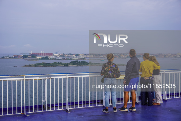 People on board the Stena Line Ferry look at the Sweden Baltic Sea coast in Karlskrona, Sweden, on August 16, 2024. 