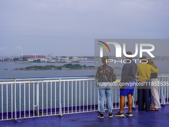 People on board the Stena Line Ferry look at the Sweden Baltic Sea coast in Karlskrona, Sweden, on August 16, 2024. (