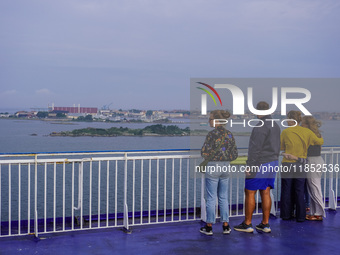 People on board the Stena Line Ferry look at the Sweden Baltic Sea coast in Karlskrona, Sweden, on August 16, 2024. (