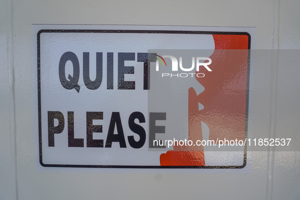 A ''Quiet Please'' sign on board a Stena Line Ferry is visible while looking at the Sweden Baltic Sea coast in Karlskrona, Sweden, on August...