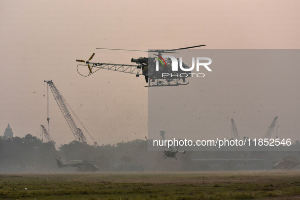 Indian Army helicopters take part in a practice run for the upcoming Vijay Diwas celebrations in Kolkata, India, on December 10, 2024. Vijay...