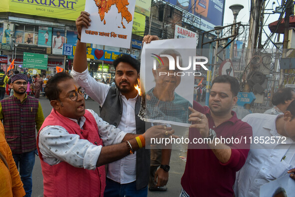 Pro-Hindu activists stage a protest in Kolkata, India, on December 10, 2024, against the attack on minorities in Bangladesh. They burn a pic...