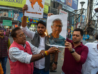 Pro-Hindu activists stage a protest in Kolkata, India, on December 10, 2024, against the attack on minorities in Bangladesh. They burn a pic...