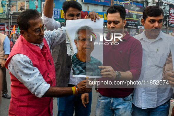 Pro-Hindu activists stage a protest in Kolkata, India, on December 10, 2024, against the attack on minorities in Bangladesh. They burn a pic...