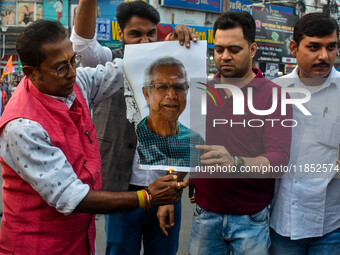 Pro-Hindu activists stage a protest in Kolkata, India, on December 10, 2024, against the attack on minorities in Bangladesh. They burn a pic...