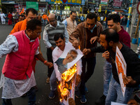 Pro-Hindu activists stage a protest in Kolkata, India, on December 10, 2024, against the attack on minorities in Bangladesh. They burn a pic...