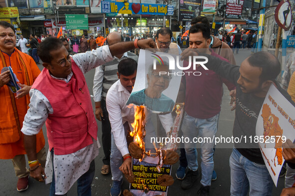 Pro-Hindu activists stage a protest in Kolkata, India, on December 10, 2024, against the attack on minorities in Bangladesh. They burn a pic...