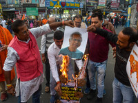 Pro-Hindu activists stage a protest in Kolkata, India, on December 10, 2024, against the attack on minorities in Bangladesh. They burn a pic...